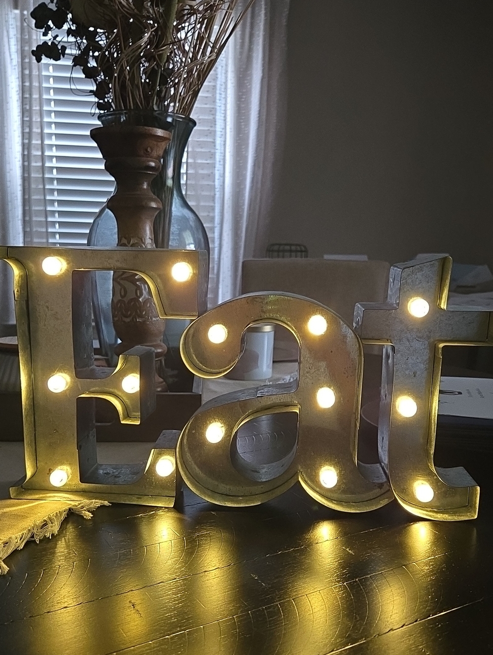 Marquee Letters "Eat" with Warm Bulb Lights